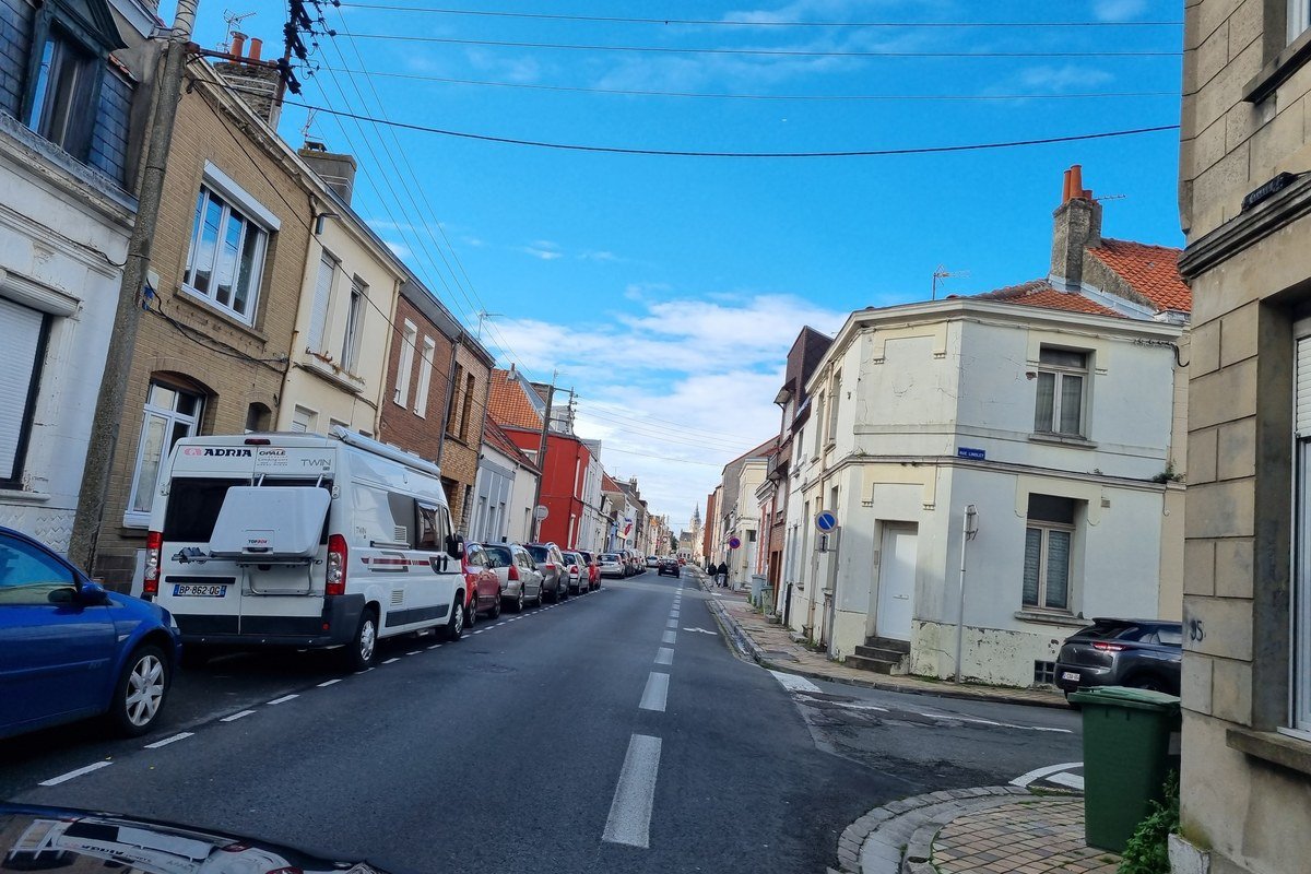 Residential street in Calais with parked cars