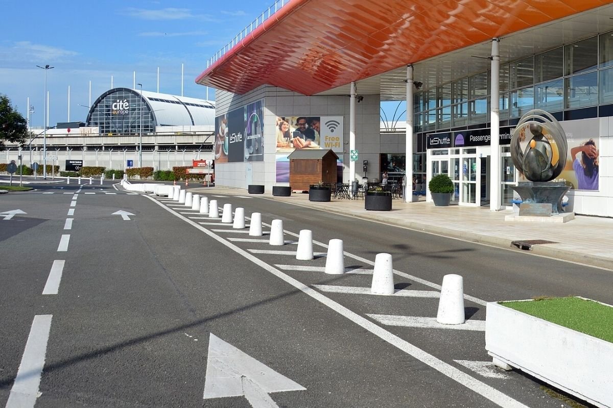 LeShuttle passenger terminal in Coquelles with Cité Europe behind it