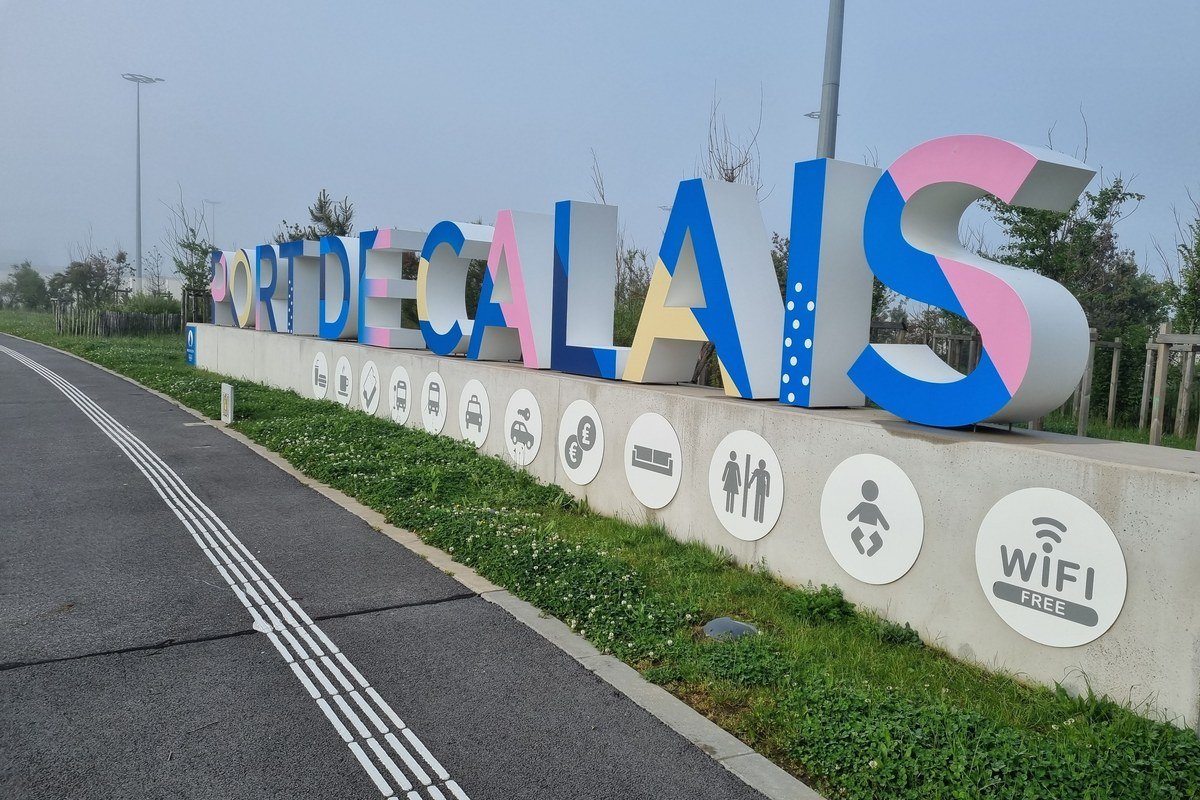 Port de Calais sign and passenger facility icons at the ferry terminal